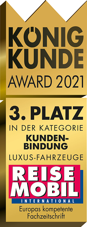Goldene Award-Plakette in Kronenform mit der Aufschrift König Kunde Award 2021, 3. Platz in der Kategorie Kundenbindung Luxus-Fahrzeuge, und dem Logo der Zeitschrift Reisemobil International am unteren Rand.